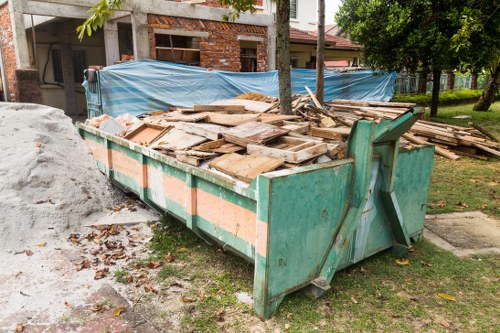 Waste collection trucks in South West London streets